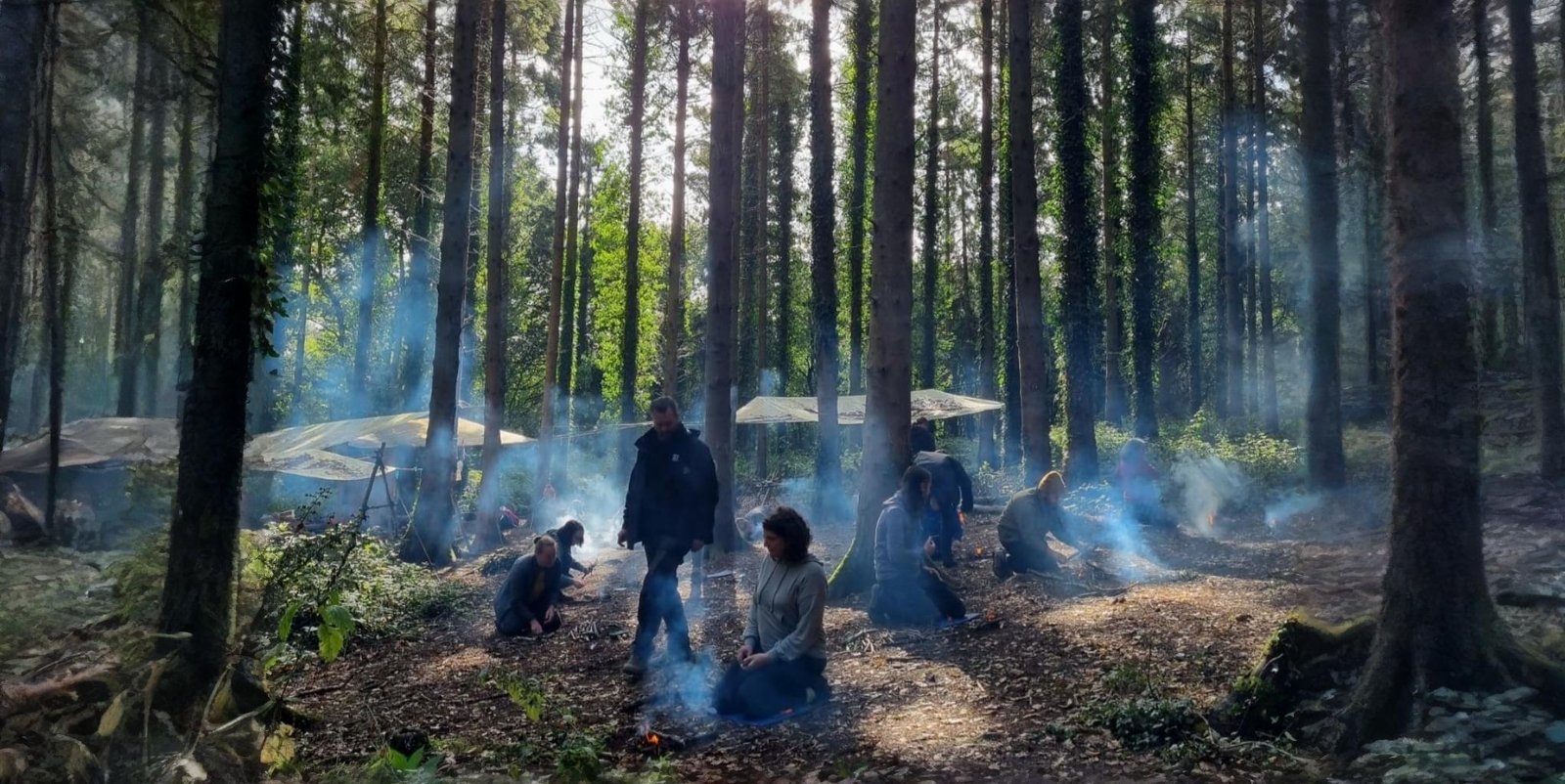 Forest outdoor survival courses in brittany : building a group campfire
